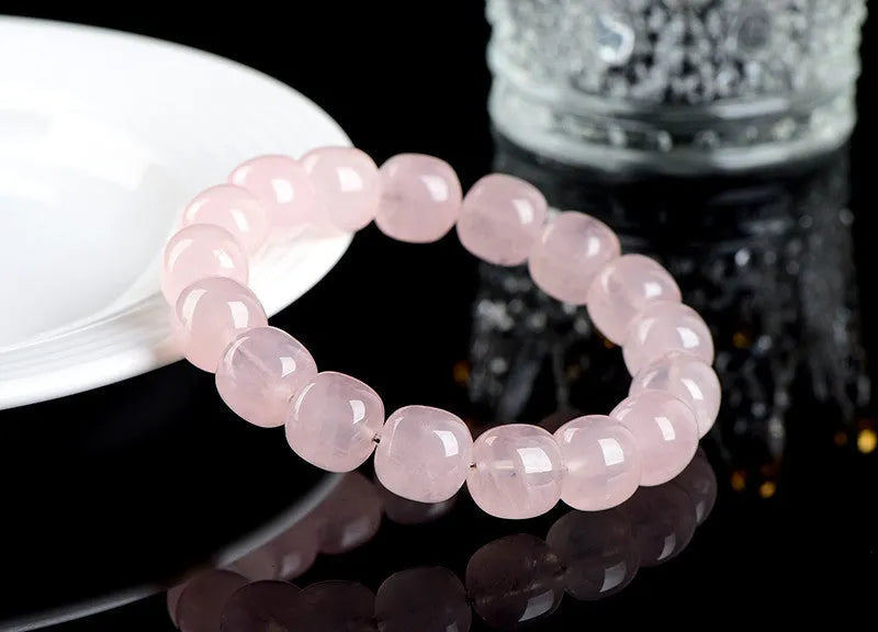 Pink crystal barrel bead bracelet with natural bamboo elements and geometric design