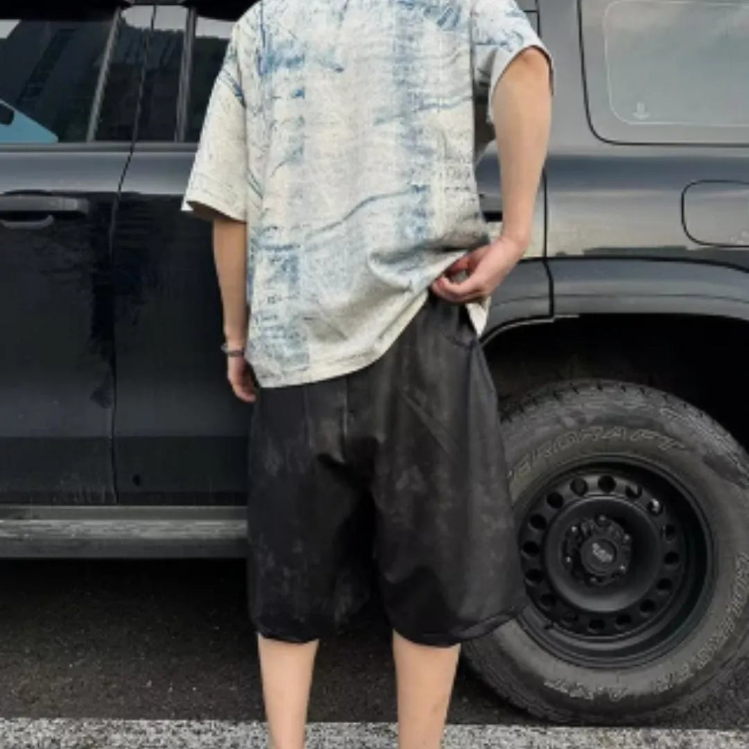 Korean-style loose fit T-shirt with distressed summer wash and tie dye print on solid colour polyester.