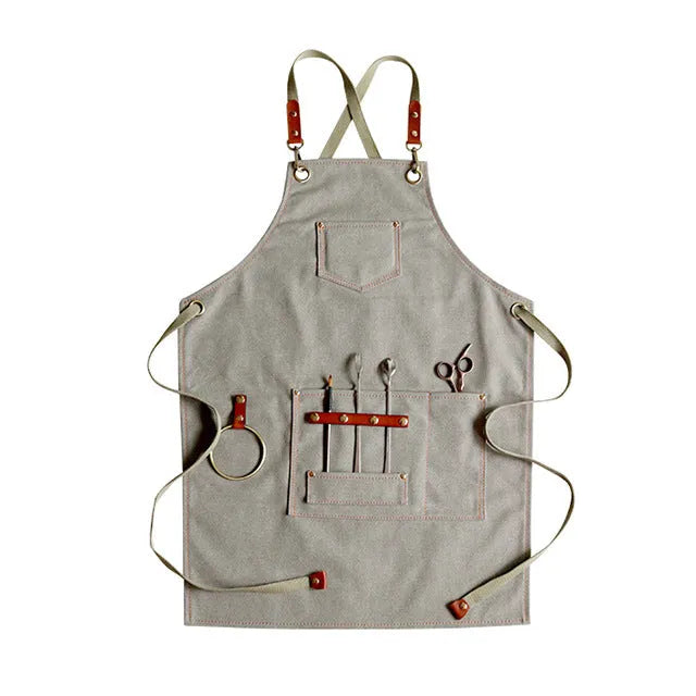 Canvas apron with cross-back straps in camel colour for cafe or baking work