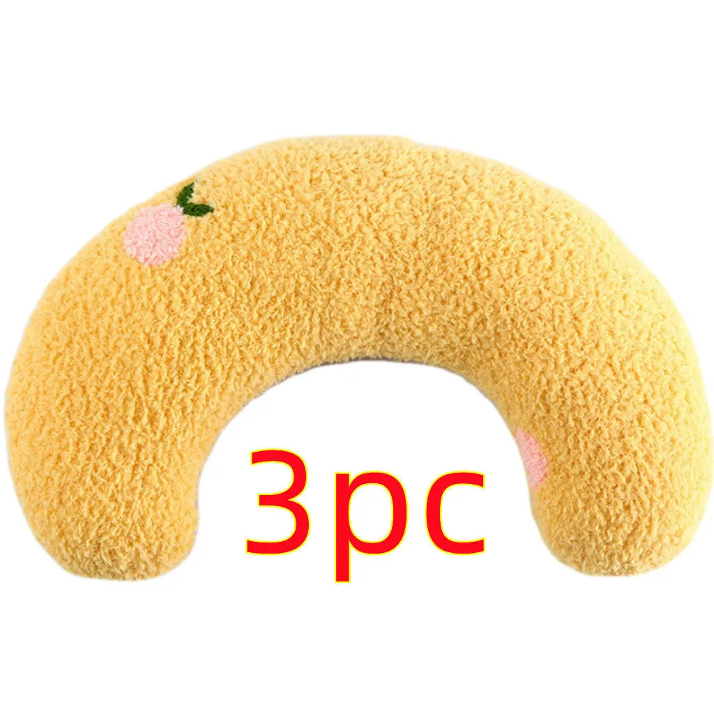 Small half-donut shaped plush pet pillow in blue, showing U-shaped design for cat or small dog neck support.