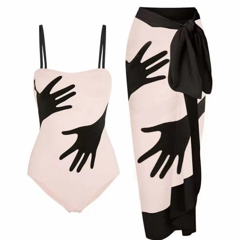 Women's one-piece bikini swimsuit with gauze skirt detail on beach