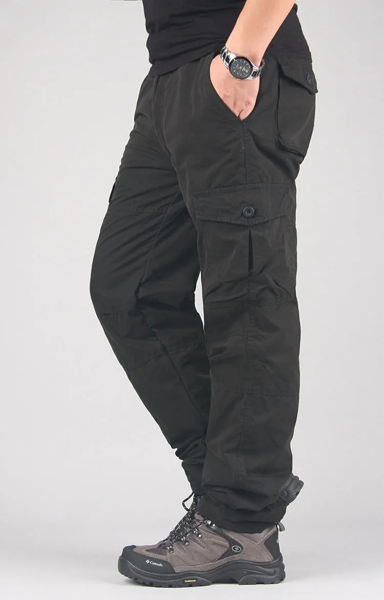 Men's stone-washed cotton overalls with a velvet lining, shown in a loose straight-leg fit.