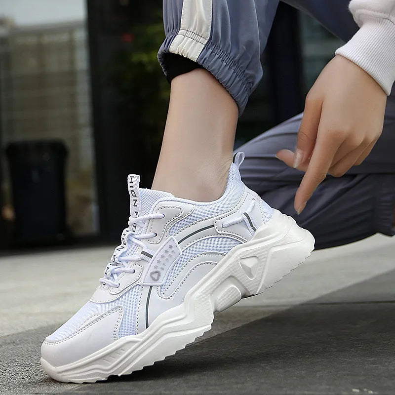 Women's white mesh casual sports shoes with thick PU sole, buckle detail, and a middle heel.