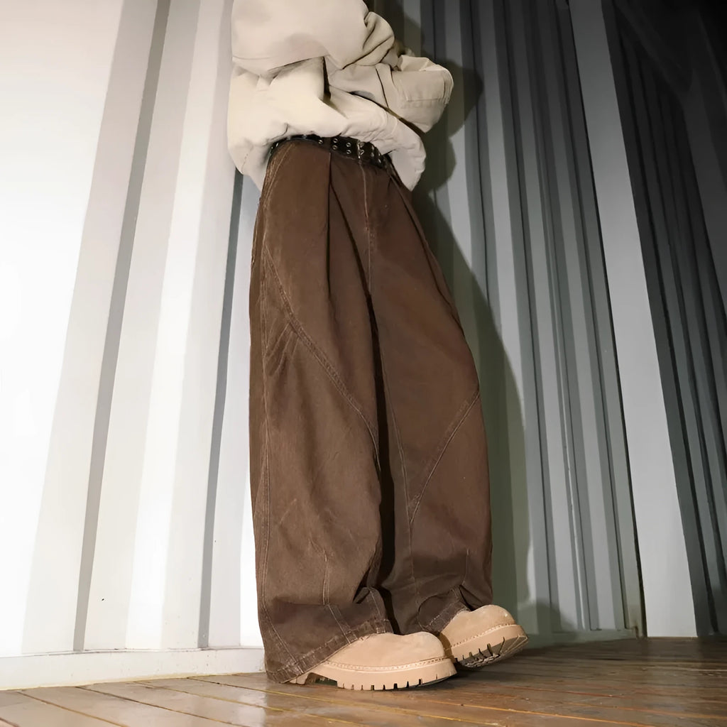 Men's pleated straight-leg trousers in apricot colour on a hanger