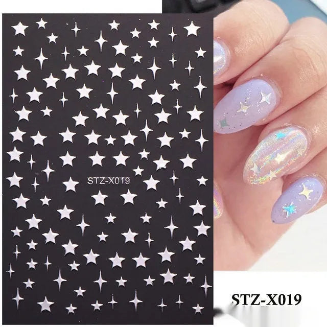 Pack of black and silver striped nail art stickers with cartoon and love pattern designs.
