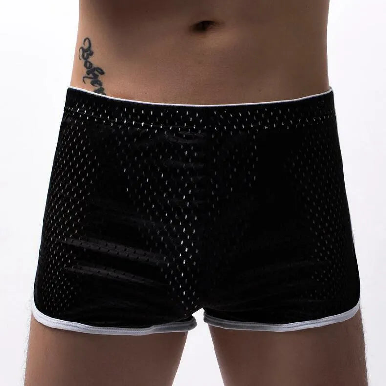 Men's knitted cotton three-point boxer shorts in black, grey, blue, and white colours laid flat.