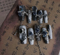 Blue plastic manicure armour suit with ornate rose and tulip floral patterns for evening wear.