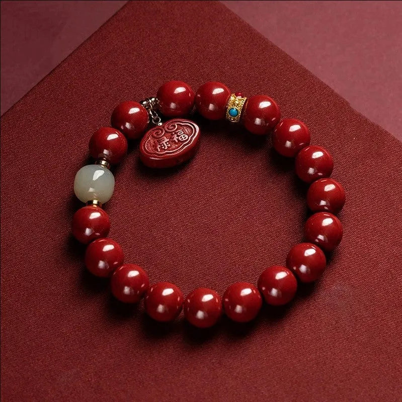 Natural cinnabar bracelet with Ping An Fu Lu design on 8mm or 10mm beads.