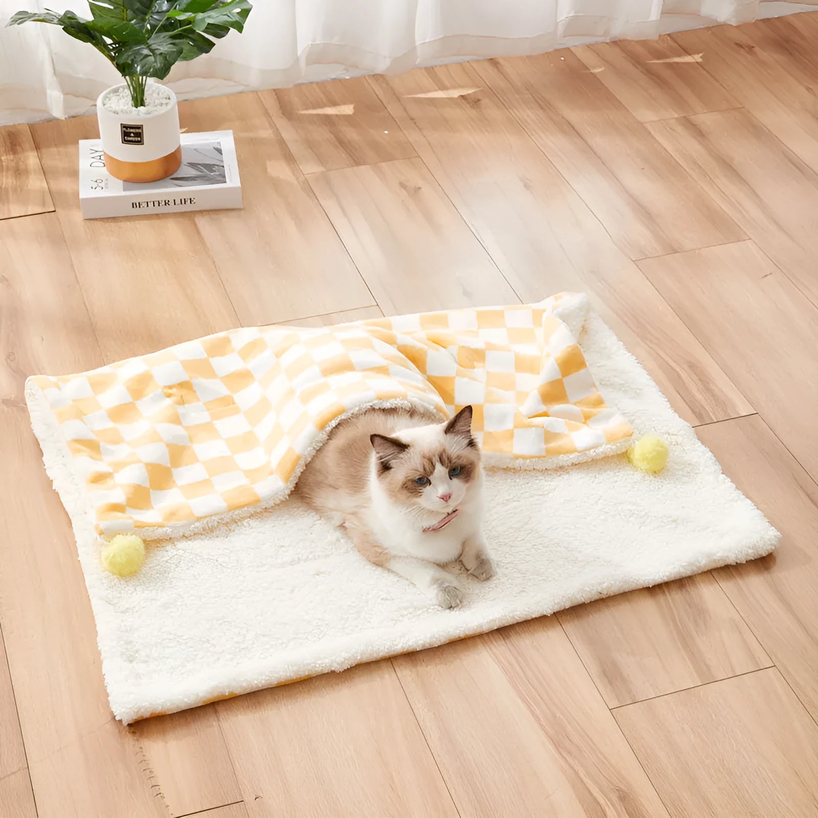 Green plaid pattern plush pet blanket for cats and dogs on a sofa