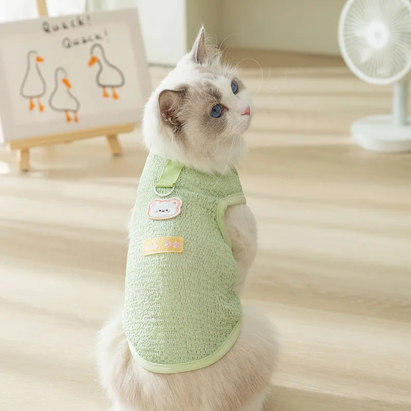 Green hollowed-out cat clothes with cartoon bear patch on knitted fabric