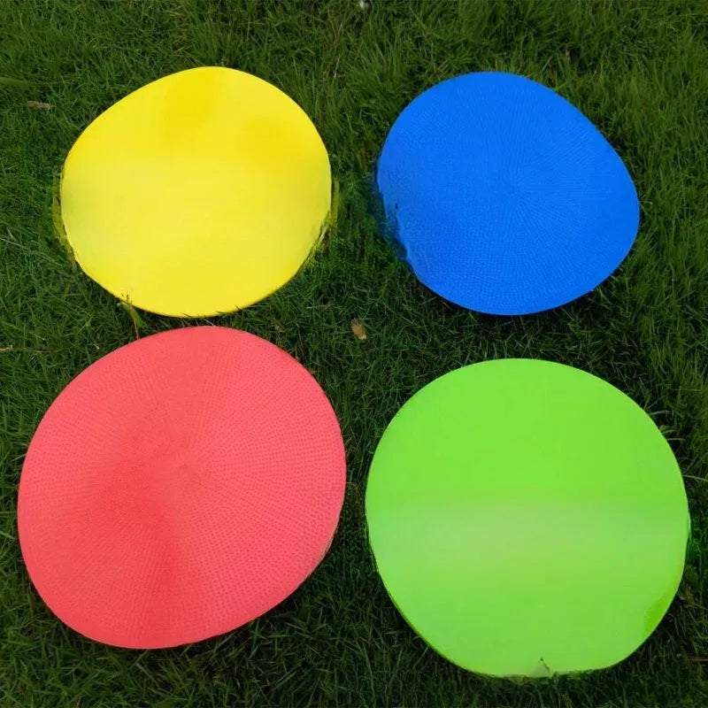 Soft yellow football landmark pad disc on grass, 23cm diameter, for training targets.