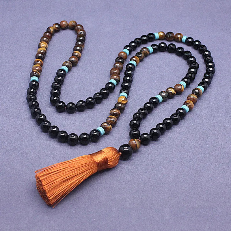 Natural agate jewellery set showing black agate bracelet and Tiger stone necklace with geometric design