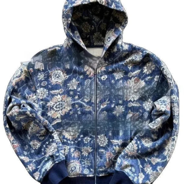A man's loose-fitting blue hooded zip coat with long sleeves on a hanger.