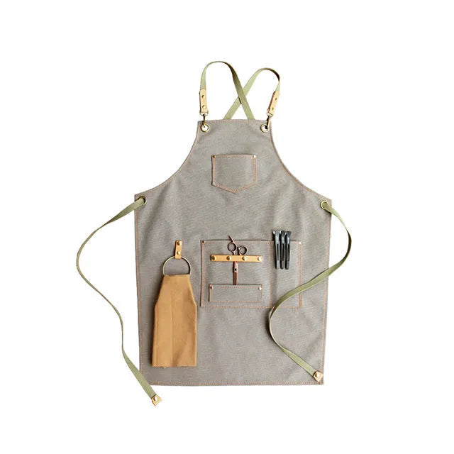 Canvas apron with cross-back straps in camel colour for cafe or baking work