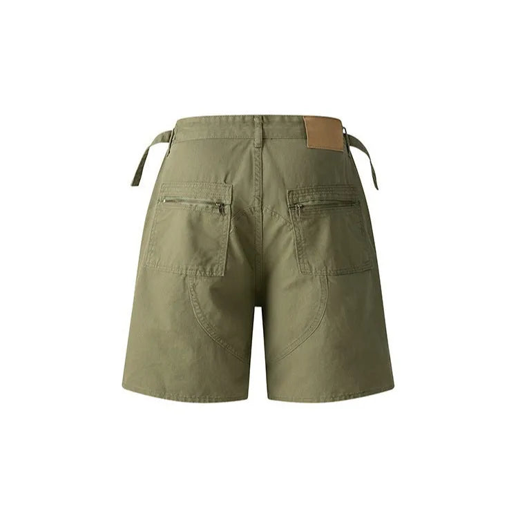 Retro loose-fit washed cotton workwear shorts for men and women in camouflage colour with a zipper fly.