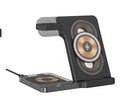Black desktop magnetic three-in-one wireless charging stand with foldable hinge and night light on table