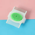 Blue and green multifunctional pet grooming comb with floating hair removal and massage nodes.