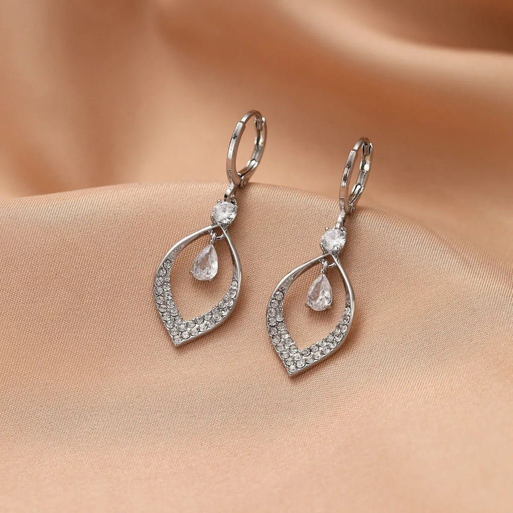 Gold and silver zircon teardrop tassel drop earrings on a copper base.