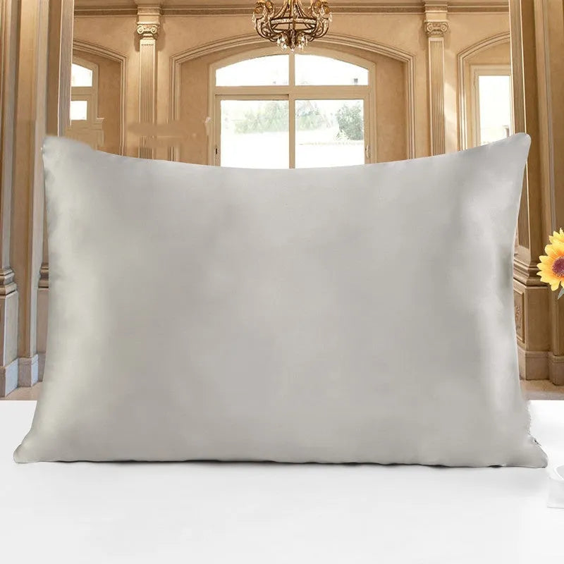 Double-sided silk pillowcase in apricot colour showing smooth satin weave texture.