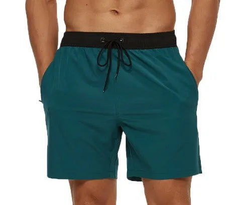 Men's blue running shorts with a stitching waistband, drawstring, and a side zippered pocket.