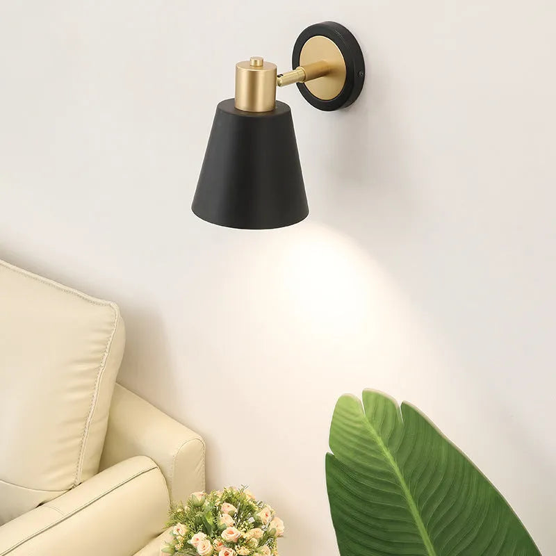 Nordic-style iron wall lamp mounted beside a bed with adjustable LED lighting