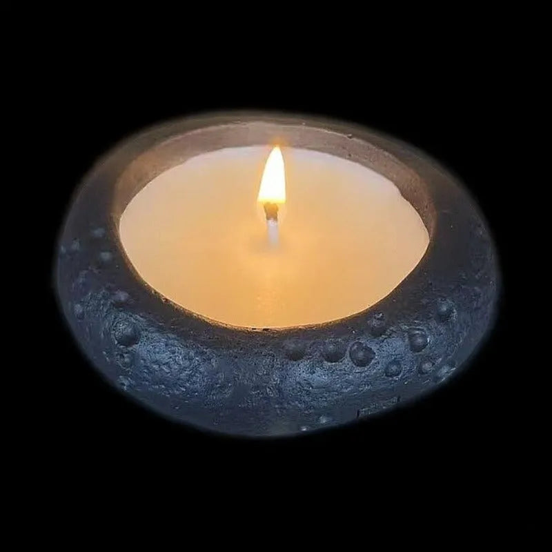 White cement fair-faced candlestick ornament for aromatherapy candles on a shelf