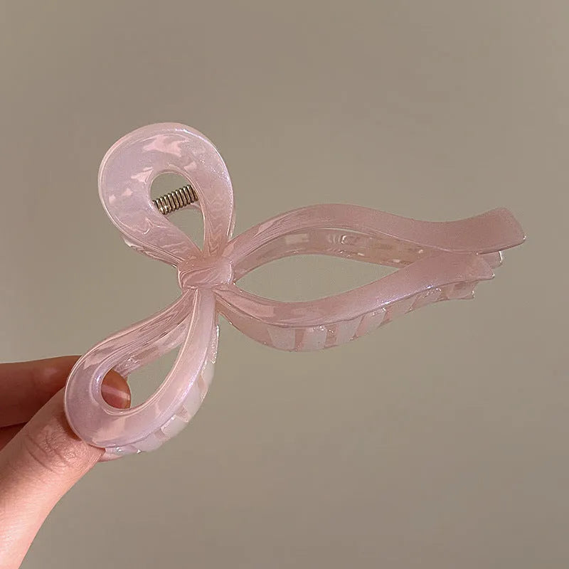 Women's ice bowknot resin hair clip with sweet bow design in blue, pink, and white colour options
