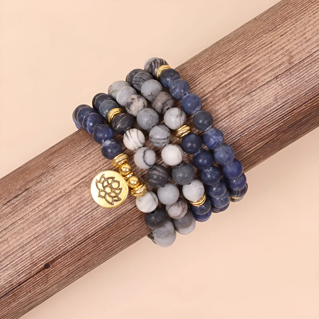 Multi-layer bracelet with blue patterned network stone beads on an alloy base, showing a fresh and sweet natural style.