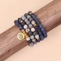 Multi-layer bracelet with blue patterned network stone beads on an alloy base, showing a fresh and sweet natural style.