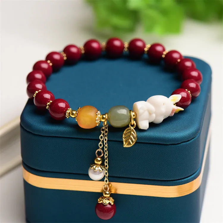 Natural cinnabar rabbit bracelet for women in national style, shown in 8mm and 10mm size options.