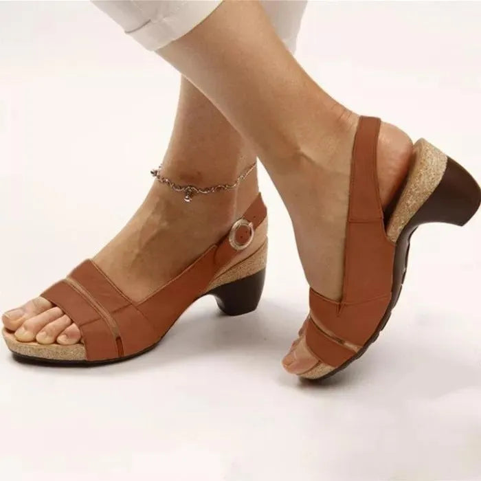 Women's ankle strap sandals in low heel peep toe style with buckle fastening, synthetic leather upper, multiple colours available