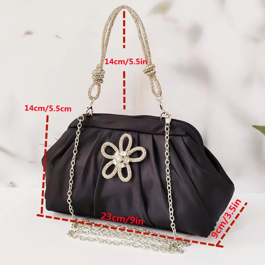 Soft lavender purple women's crossbody bag with chain details and a structured shell shape.