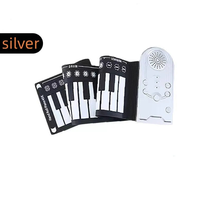 Portable folding 49-key electronic keyboard with speaker in compact rolled position showing silicone rubber keys and ABS plastic controls