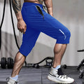 Man wearing grey cropped ice silk sports pants made from quick-dry nylon fabric.