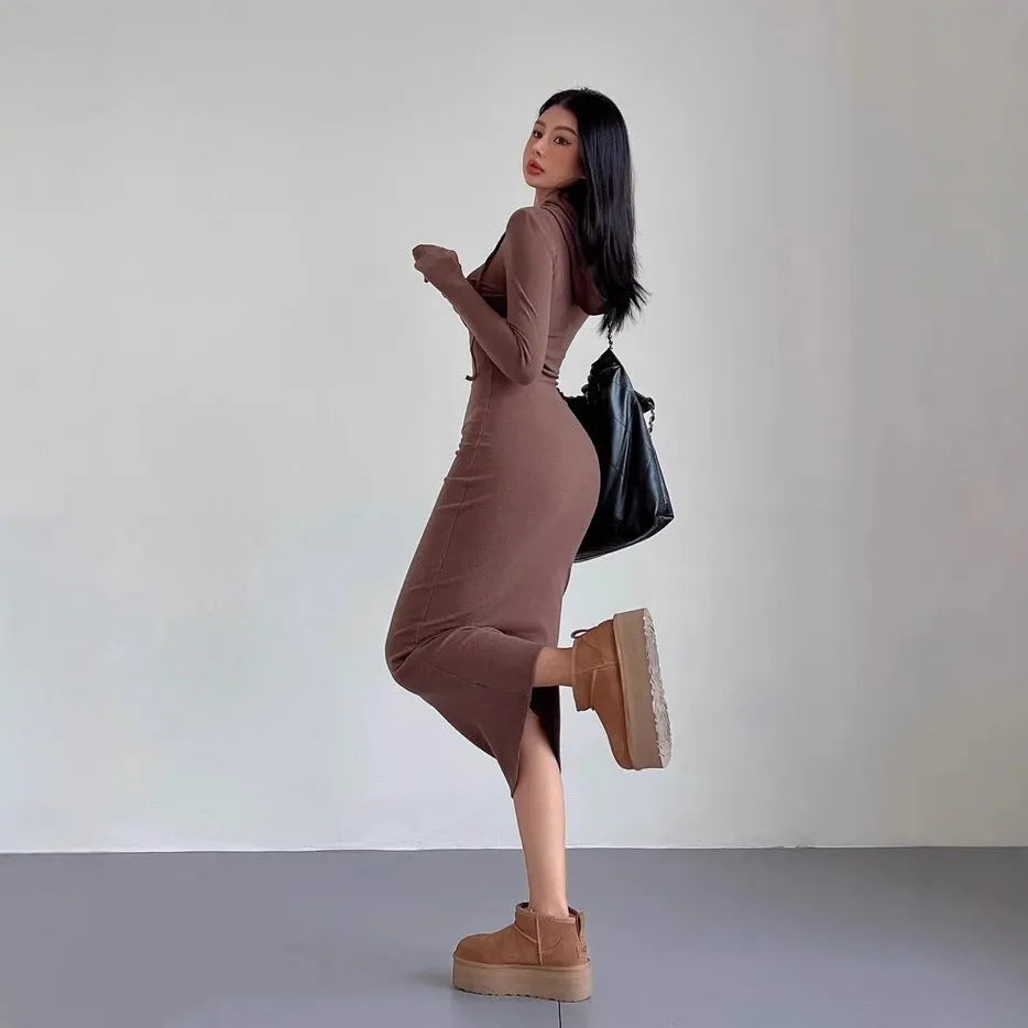Women's grey hooded sheath dress with long sleeves and a high waist.
