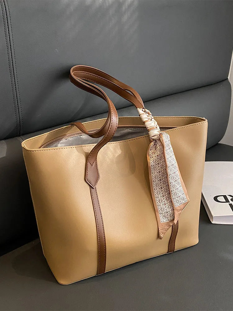 Canvas bucket tote bag with crossbody strap showing sandwich pocket organisation and soft construction