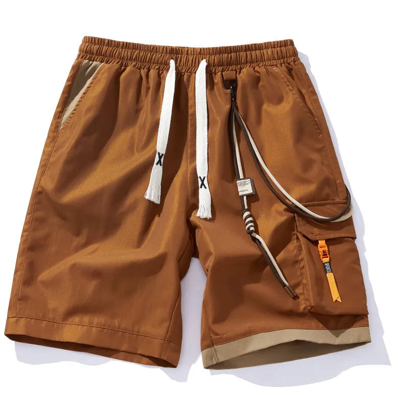 Man wearing coffee-coloured loose-fit bamboo fibre sports shorts with a straight leg and cropped length.