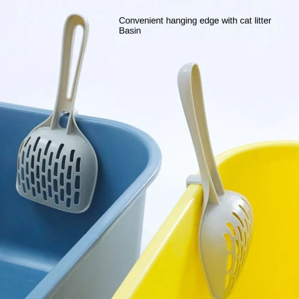 Grey plastic cat litter scoop with matching base for litter box cleaning
