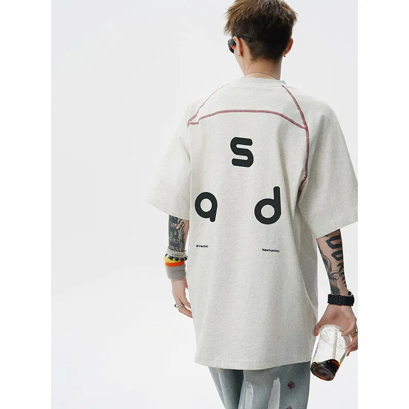 Cotton short-sleeve t-shirt with letter print design in loose fit showing round neck collar
