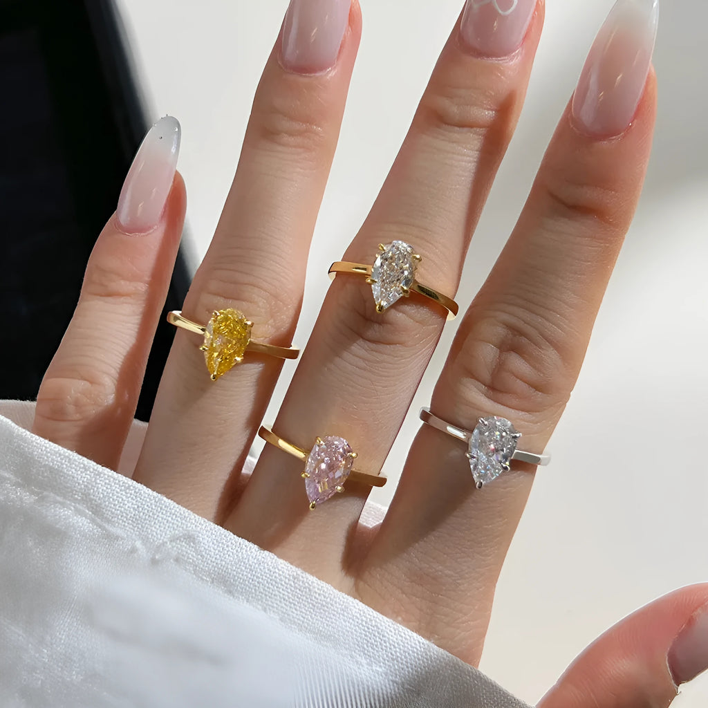 Sterling silver ring with pear-shaped high-grade zircon inlay, closed band, electroplated finish, multiple colours available