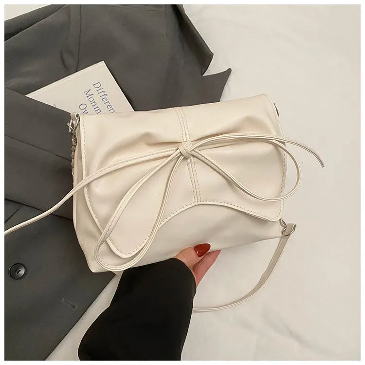 Women's underarm crossbody bag in horizontal square shape with sandwich pocket design and crossbody strap