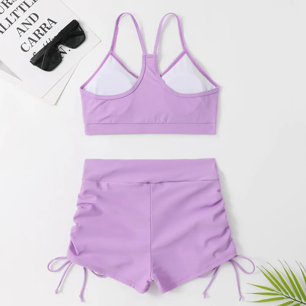 Purple and black women's high waist bikini swimsuit set on a mannequin.