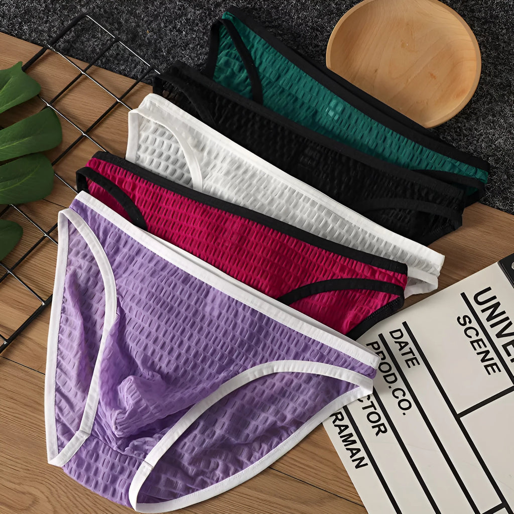 Men's low waist transparent lace underwear in a choice of colours on a size chart.