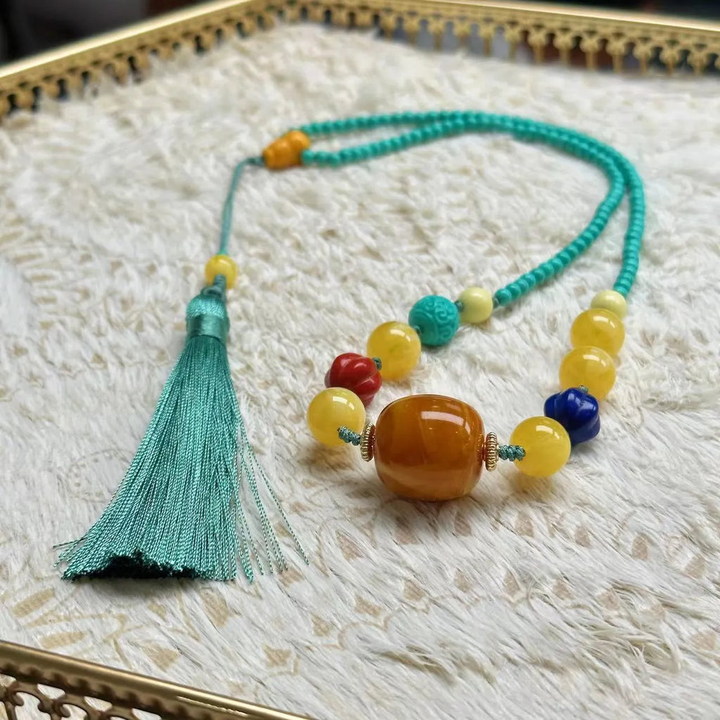 Turquoise stone pendant with hand-woven mesh flower design on adjustable ball bead necklace chain