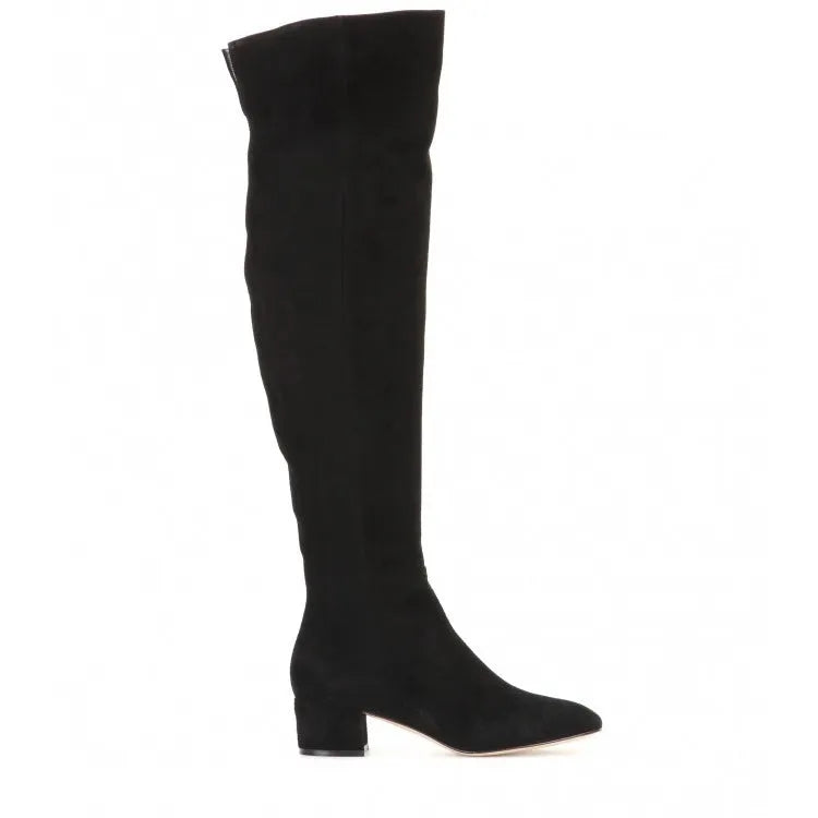 Women's grey suede over the knee flat boots with a low thick heel and pointed toe on a neutral background.