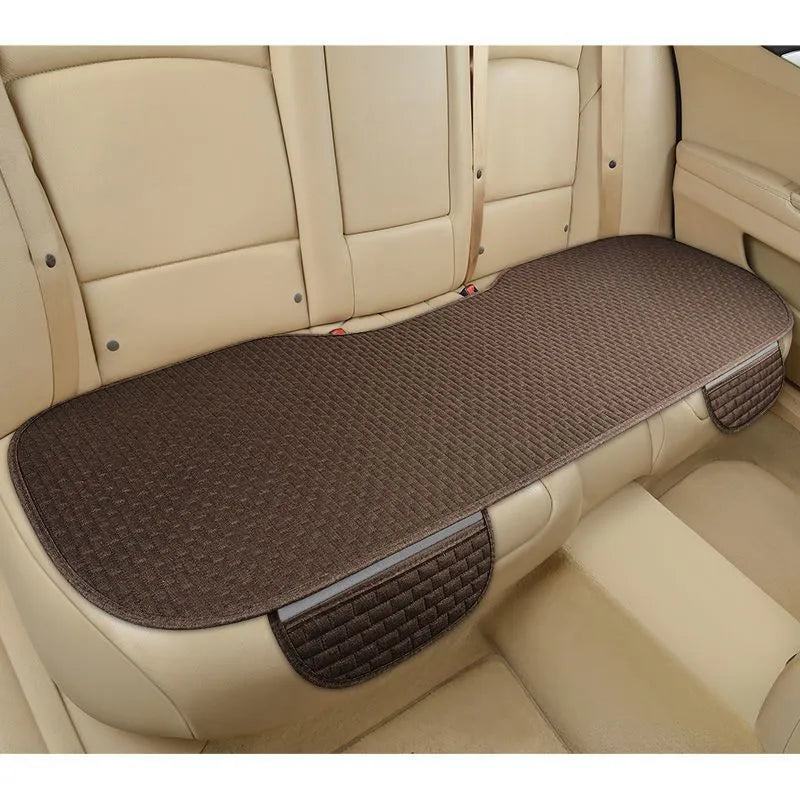 Linen car seat cushion with plaid design available in single seat or three-piece set configurations