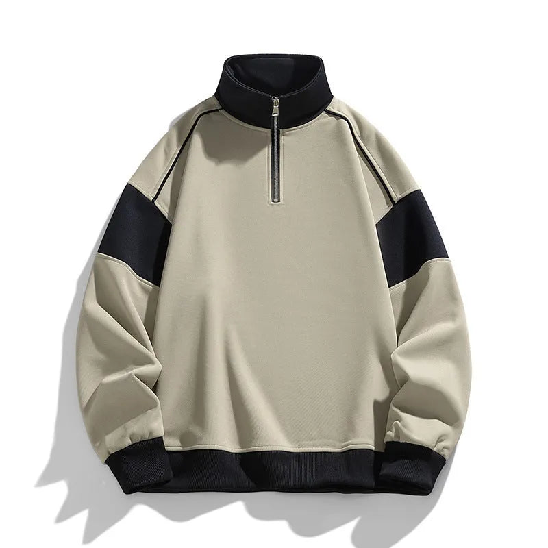 A man's thin corduroy hooded pullover sweater with drop shoulders and loose lapels, in a neutral colour.