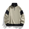A man's thin corduroy hooded pullover sweater with drop shoulders and loose lapels, in a neutral colour.