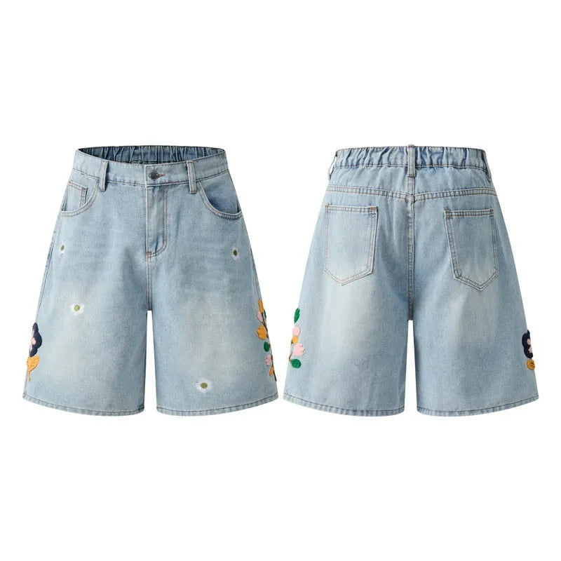 Retro loose-fit washed cotton workwear shorts for men and women in camouflage colour with a zipper fly.