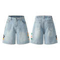 Retro loose-fit washed cotton workwear shorts for men and women in camouflage colour with a zipper fly.